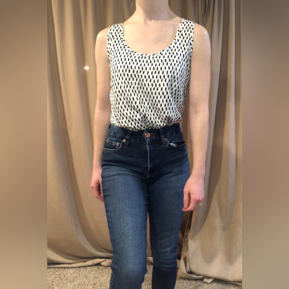 Small (4-6) tank top. Fits like size 2. Black and white. Dress tank top.